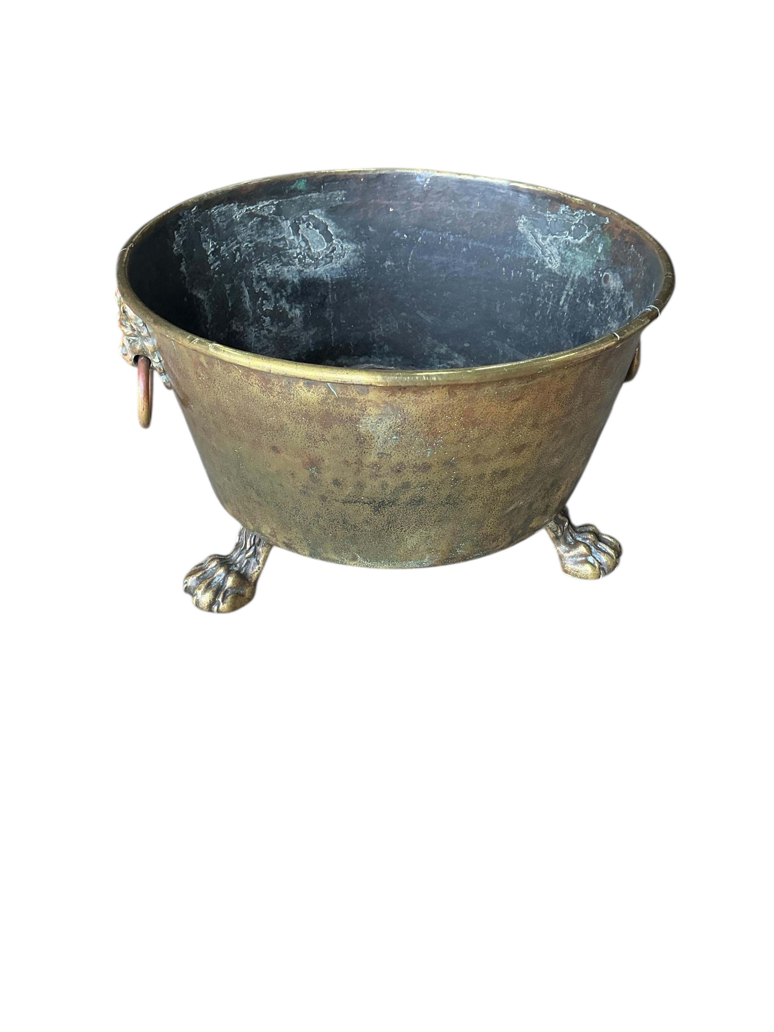 A circular brass log bin, diameter 56cm, height 34cm